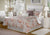 Orange, taupe, and white floral pattern comforter set with matching shams and pillows
