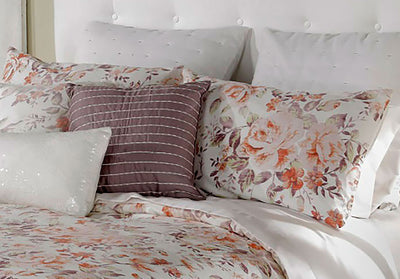 Orange, taupe, and white sham floral pattern zoomed in